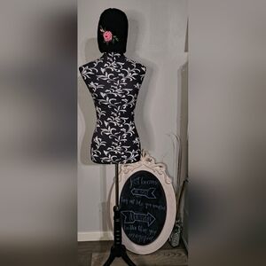 Elegant Black Hat with Pink Floral Accent